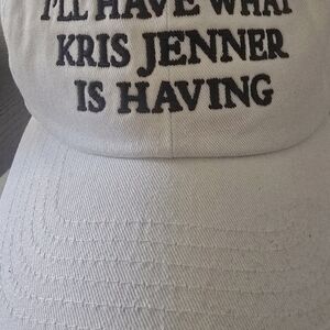 White Cap with Black Text. " I WILL HAVE WHAT KRIS JENNER IS HAVING " UNISEX HAT